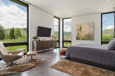 Perched above the Snake River with commanding views of Wolf on Snake River Sporting Club in Wyoming - for sale on GolfHomes.com, golf home, golf lot