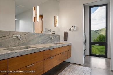 Perched above the Snake River with commanding views of Wolf on Snake River Sporting Club in Wyoming - for sale on GolfHomes.com, golf home, golf lot