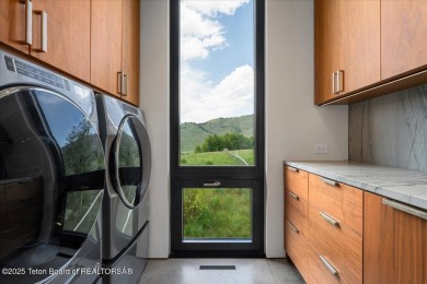 Perched above the Snake River with commanding views of Wolf on Snake River Sporting Club in Wyoming - for sale on GolfHomes.com, golf home, golf lot