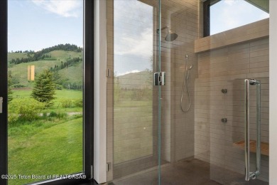 Perched above the Snake River with commanding views of Wolf on Snake River Sporting Club in Wyoming - for sale on GolfHomes.com, golf home, golf lot