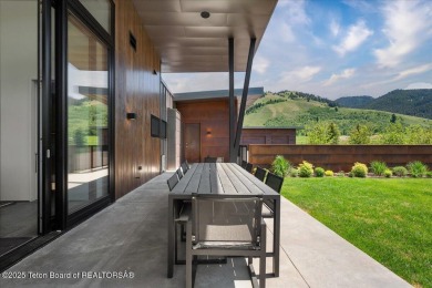 Perched above the Snake River with commanding views of Wolf on Snake River Sporting Club in Wyoming - for sale on GolfHomes.com, golf home, golf lot