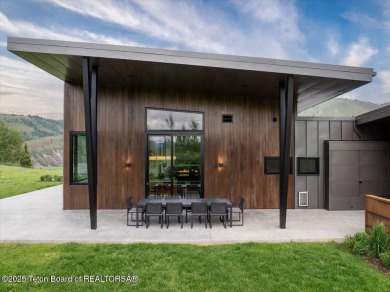 Perched above the Snake River with commanding views of Wolf on Snake River Sporting Club in Wyoming - for sale on GolfHomes.com, golf home, golf lot