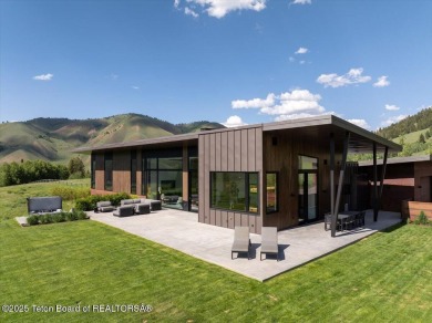 Perched above the Snake River with commanding views of Wolf on Snake River Sporting Club in Wyoming - for sale on GolfHomes.com, golf home, golf lot