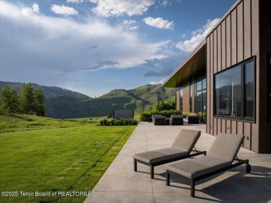 Perched above the Snake River with commanding views of Wolf on Snake River Sporting Club in Wyoming - for sale on GolfHomes.com, golf home, golf lot