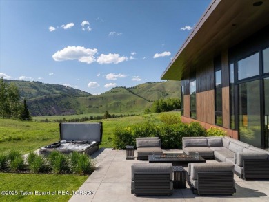 Perched above the Snake River with commanding views of Wolf on Snake River Sporting Club in Wyoming - for sale on GolfHomes.com, golf home, golf lot