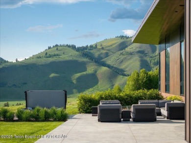 Perched above the Snake River with commanding views of Wolf on Snake River Sporting Club in Wyoming - for sale on GolfHomes.com, golf home, golf lot