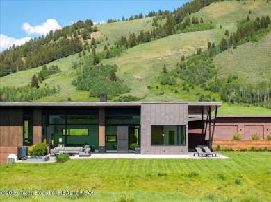 Perched above the Snake River with commanding views of Wolf on Snake River Sporting Club in Wyoming - for sale on GolfHomes.com, golf home, golf lot