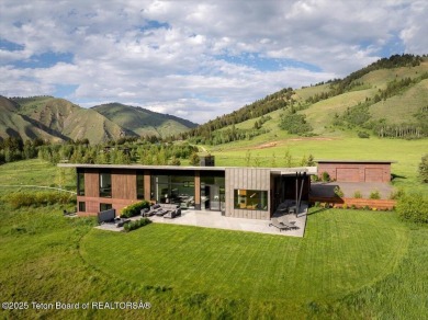 Perched above the Snake River with commanding views of Wolf on Snake River Sporting Club in Wyoming - for sale on GolfHomes.com, golf home, golf lot