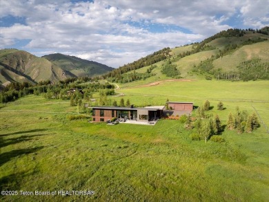Perched above the Snake River with commanding views of Wolf on Snake River Sporting Club in Wyoming - for sale on GolfHomes.com, golf home, golf lot