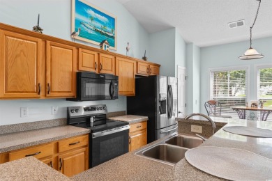 Welcome to this beautifully updated 3-bedroom, 2.5-bath end-unit on Barefoot Resort and Golf Club  in South Carolina - for sale on GolfHomes.com, golf home, golf lot
