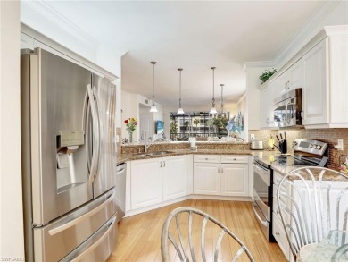 3bd 2 ba end unit condo, with a beautiful lake view. Condo has on Club at Pelican Bay Golf Course in Florida - for sale on GolfHomes.com, golf home, golf lot