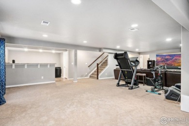 With new carpet on the main floor and fresh front yard on Harmony Golf Club in Colorado - for sale on GolfHomes.com, golf home, golf lot
