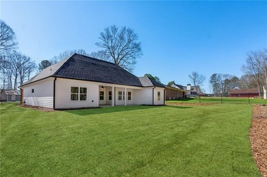 Nestled in the prestigious gated community of The Orchard in on The Orchard Golf and Country Club in Georgia - for sale on GolfHomes.com, golf home, golf lot