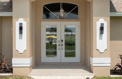 Welcome to your luxury waterfront oasis in Southwest Cape Coral on Royal Tee Country Club in Florida - for sale on GolfHomes.com, golf home, golf lot