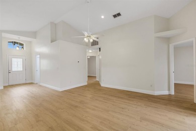 This beautiful POOL home is located in a gated, golf course on Ridgewood Lakes Golf and Country Club in Florida - for sale on GolfHomes.com, golf home, golf lot