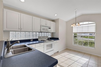 This beautiful POOL home is located in a gated, golf course on Ridgewood Lakes Golf and Country Club in Florida - for sale on GolfHomes.com, golf home, golf lot