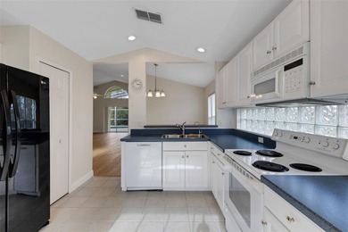 This beautiful POOL home is located in a gated, golf course on Ridgewood Lakes Golf and Country Club in Florida - for sale on GolfHomes.com, golf home, golf lot