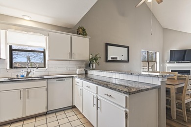 Discover refined living at its best in this pristine corner-unit on Pointe Royale Village Country Club in Missouri - for sale on GolfHomes.com, golf home, golf lot