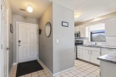 Discover refined living at its best in this pristine corner-unit on Pointe Royale Village Country Club in Missouri - for sale on GolfHomes.com, golf home, golf lot