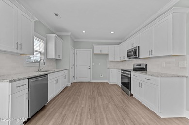 Designed with family living in mind, this home has a thoughtful on Ayden Golf and Country Club in North Carolina - for sale on GolfHomes.com, golf home, golf lot