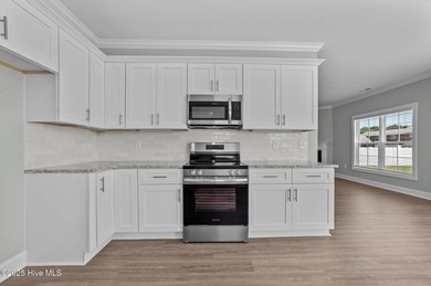 Designed with family living in mind, this home has a thoughtful on Ayden Golf and Country Club in North Carolina - for sale on GolfHomes.com, golf home, golf lot