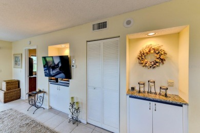 This 1ST FLOOR END UNIT condo with DEEDED COVERED PARKING WITH on Terra Ceia Golf and Country Club in Florida - for sale on GolfHomes.com, golf home, golf lot