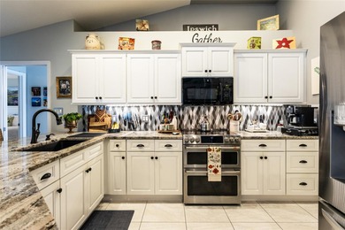 Welcome to this stunning 3-bedroom, 2-full-bath pool home on The Grand Club Cypress Course in Florida - for sale on GolfHomes.com, golf home, golf lot