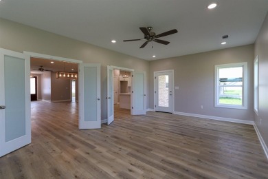 All Brick beautiful home with bonus and three car garage on a on Paragould Country Club in Arkansas - for sale on GolfHomes.com, golf home, golf lot
