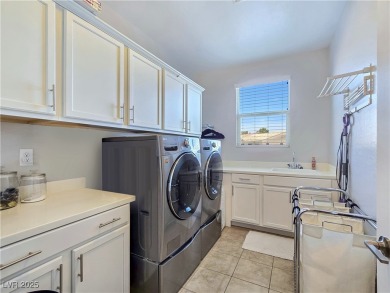 Located in the highly desirable, guard-gated Rhodes Ranch golf on Rhodes Ranch Golf Club in Nevada - for sale on GolfHomes.com, golf home, golf lot