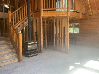 Explore the allure of log cabin living in this charming home on Meadowcreek Golf Resort in Idaho - for sale on GolfHomes.com, golf home, golf lot