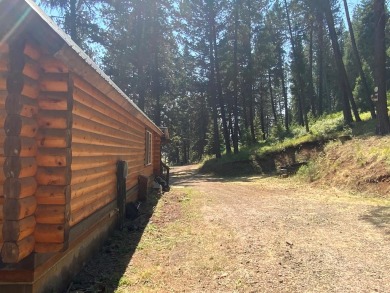 Explore the allure of log cabin living in this charming home on Meadowcreek Golf Resort in Idaho - for sale on GolfHomes.com, golf home, golf lot