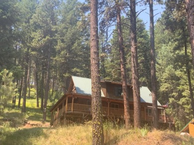 Explore the allure of log cabin living in this charming home on Meadowcreek Golf Resort in Idaho - for sale on GolfHomes.com, golf home, golf lot