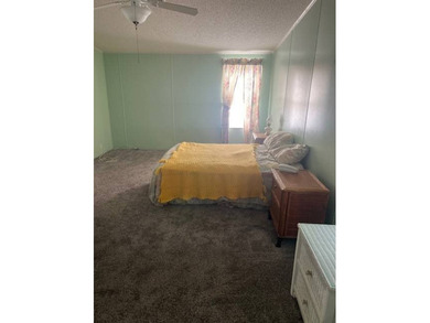 Well-priced, spacious home in a beautiful setting at The on Hamptons Golf Club in Florida - for sale on GolfHomes.com, golf home, golf lot