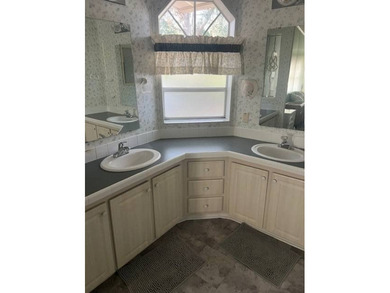 Well-priced, spacious home in a beautiful setting at The on Hamptons Golf Club in Florida - for sale on GolfHomes.com, golf home, golf lot