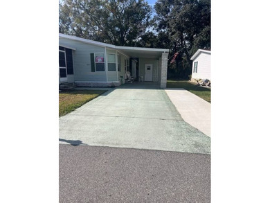 Well-priced, spacious home in a beautiful setting at The on Hamptons Golf Club in Florida - for sale on GolfHomes.com, golf home, golf lot