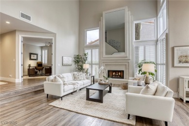 Floor-to-ceiling windows frame the lush greens of the 7th hole on Canyon Gate Country Club in Nevada - for sale on GolfHomes.com, golf home, golf lot