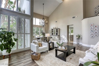 Floor-to-ceiling windows frame the lush greens of the 7th hole on Canyon Gate Country Club in Nevada - for sale on GolfHomes.com, golf home, golf lot