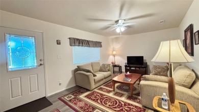 Experience relaxed lake living in this inviting 2-bedroom on Links At Lands End in Texas - for sale on GolfHomes.com, golf home, golf lot