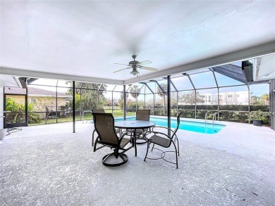 Charming 3-Bedroom Solar Heated Pool Home with Golf Course Views on Seminole Lake Country Club in Florida - for sale on GolfHomes.com, golf home, golf lot