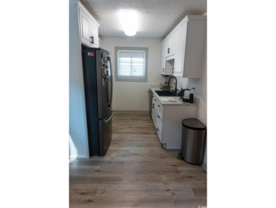 Welcome to SHOREWOOD! This beautifully updated condo, nestled on on Myrtlewood Golf Course and Club  in South Carolina - for sale on GolfHomes.com, golf home, golf lot