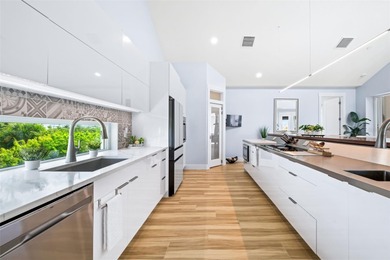 Experience exceptional coastal living in this custom 2023 home on Lemon Bay Golf Club in Florida - for sale on GolfHomes.com, golf home, golf lot