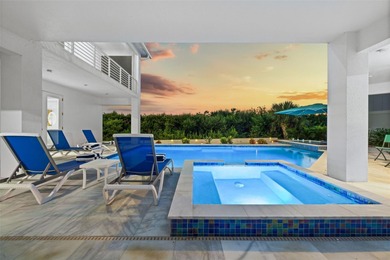 Experience exceptional coastal living in this custom 2023 home on Lemon Bay Golf Club in Florida - for sale on GolfHomes.com, golf home, golf lot