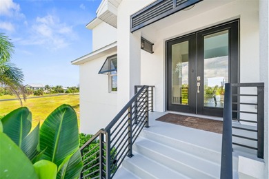 Experience exceptional coastal living in this custom 2023 home on Lemon Bay Golf Club in Florida - for sale on GolfHomes.com, golf home, golf lot