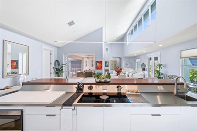 Experience exceptional coastal living in this custom 2023 home on Lemon Bay Golf Club in Florida - for sale on GolfHomes.com, golf home, golf lot