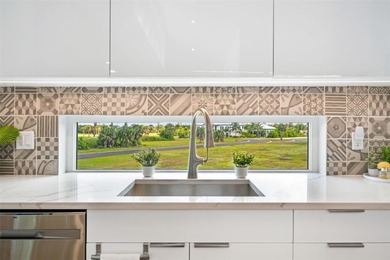 Experience exceptional coastal living in this custom 2023 home on Lemon Bay Golf Club in Florida - for sale on GolfHomes.com, golf home, golf lot