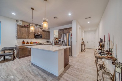 Located in prestigious gated neighborhood of The Canyons At on Laughlin Ranch Golf Club in Arizona - for sale on GolfHomes.com, golf home, golf lot