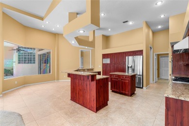 Welcome to this elegant residence in the highly sought-after on Hunters Green Country Club in Florida - for sale on GolfHomes.com, golf home, golf lot