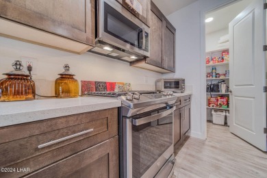 Located in prestigious gated neighborhood of The Canyons At on Laughlin Ranch Golf Club in Arizona - for sale on GolfHomes.com, golf home, golf lot