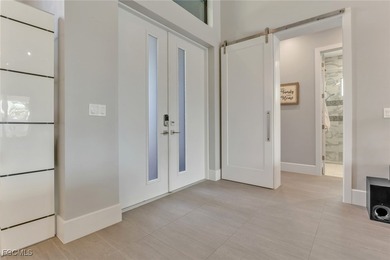 Discover modern coastal living in this Beautiful custom Home on Burnt Store Golf Club in Florida - for sale on GolfHomes.com, golf home, golf lot