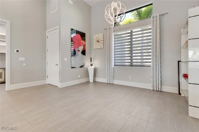 Discover modern coastal living in this Beautiful custom Home on Burnt Store Golf Club in Florida - for sale on GolfHomes.com, golf home, golf lot